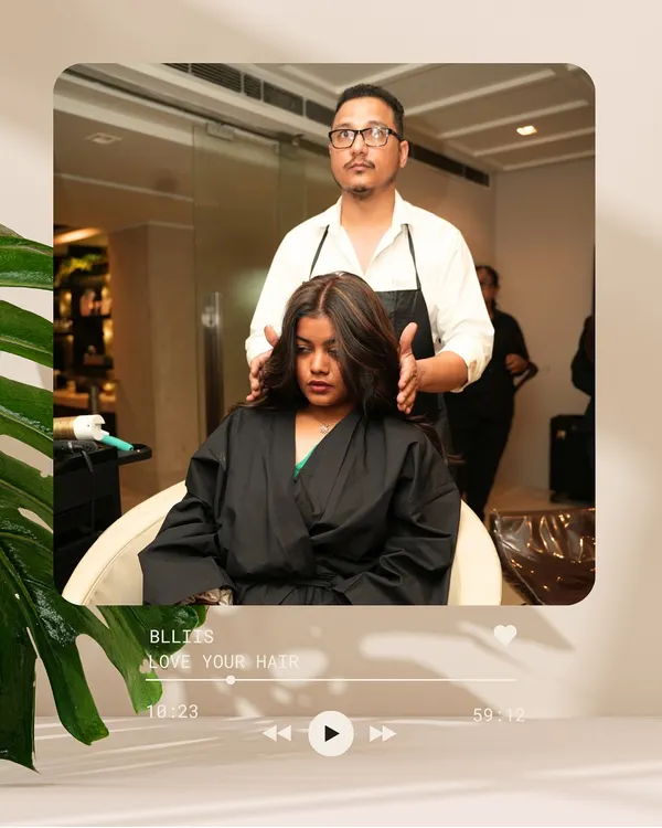 The process begins. Here, our stylist meticulously applies highlights, the first step in a beautiful color transformation that will add depth and dimension.