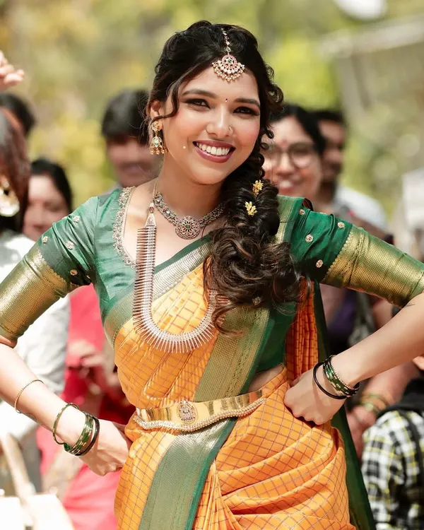 The vibe of a bride who is unapologetically herself. Jothi looks absolutely radiant and full of life in a custom-designed yellow and green checked saree for her engagement.