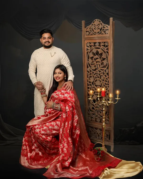 I believe there is a divine elegance in celebrating motherhood with our traditions. This studio session features a mom-to-be in a stunning red Banarasi saree, creating a regal and timeless portrait that honors her journey.