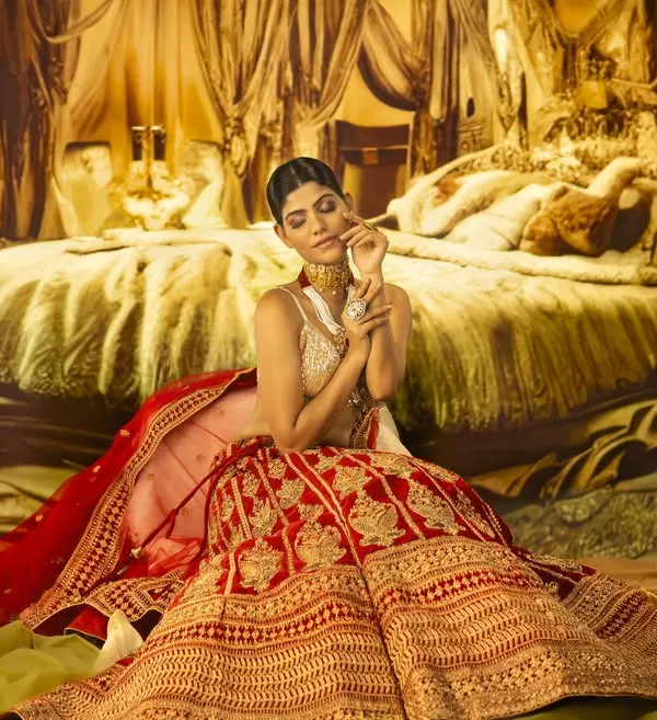 Capturing the essence of regal grace. This stunning bridal portrait was created in the studio with a projected backdrop, with lighting carefully placed to highlight the rich textures and details of the lehenga.