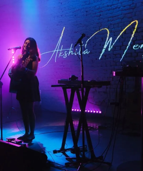 A solo performance at Antisocial, Mumbai. The purple and blue lights, my name projected on the wall, it felt like a scene from a movie.