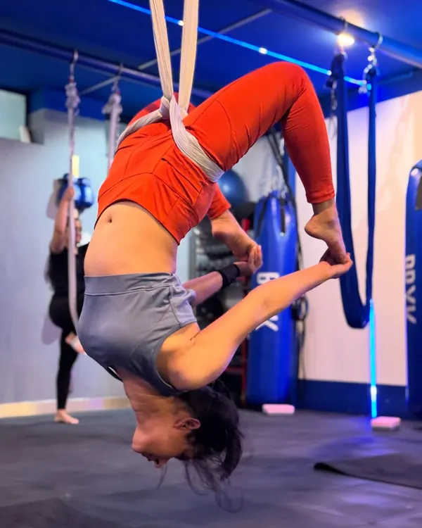 This is what it feels like to flip your perspective. In our aerial yoga classes, we use the hammock to build strength, find balance, and stretch in ways you never thought possible.