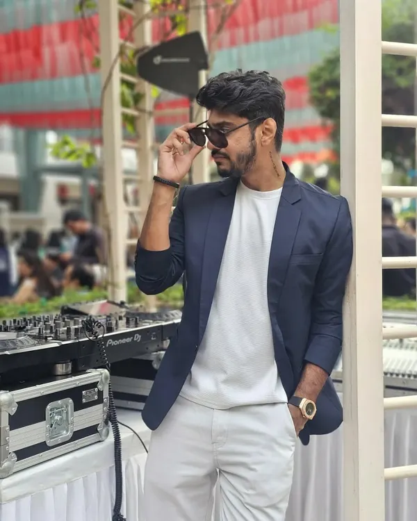A cool, confident look for a daytime event. Leaning against my console in a blazer and sunglasses, ready to bring the vibes.