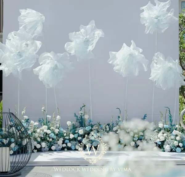 We created a dreamy photo-op for a poolside brunch with these life-sized, cloud-like florals. The whimsical structures against the clear sky provided a perfect, ethereal backdrop for pictures.