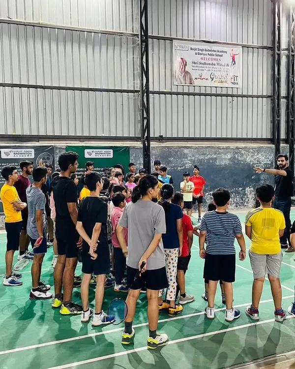 This is where champions are made. I teach my players that the game is won in the mind before they even step on the court. Here, I'm leading a group session on mental toughness, a core part of my training philosophy.