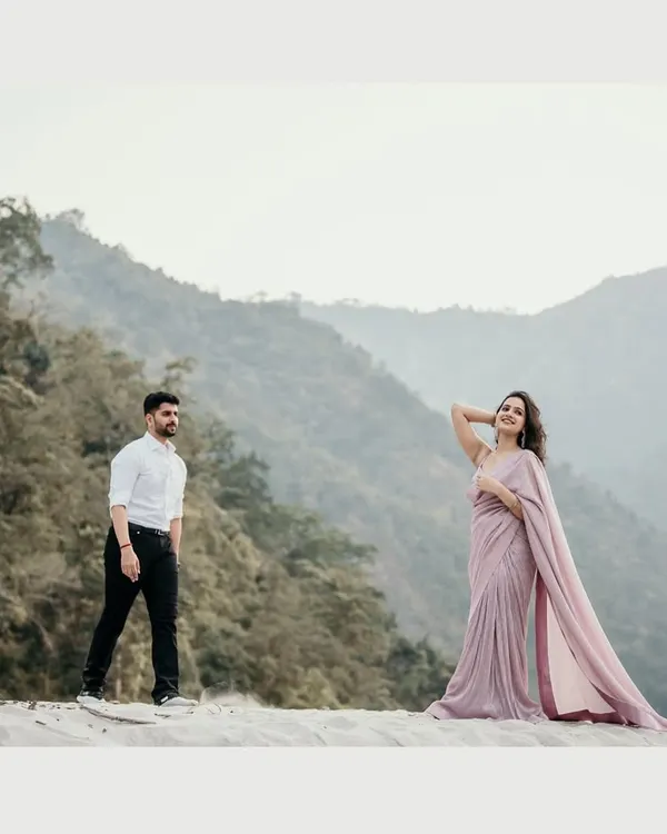 A breathtaking pre-wedding shoot on the serene sands with a majestic mountain backdrop. This is for couples who dream of a cinematic and adventurous start to their forever, capturing love on a grand scale.