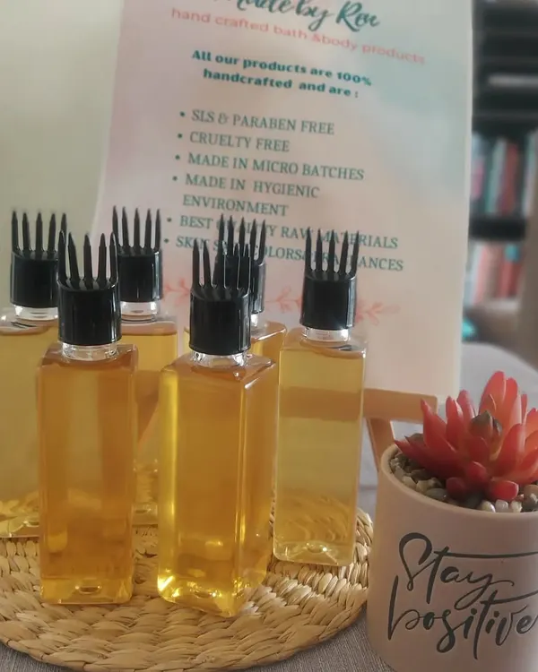 This is my CO2 Herbal Hair Oil, handmade in micro-batches. It contains potent extracts from over 25 herbs, 12 essential oils, and 8 carrier oils, including Black Jamaican Castor Oil. The comb applicator makes it easy to nourish your scalp directly.