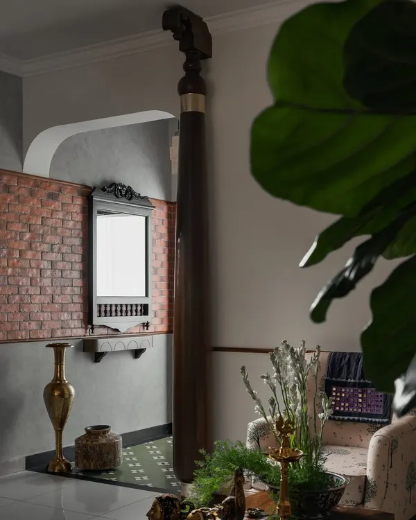 They say first impressions matter, and at my 'Kaalam' project, the foyer sets the tone. The sthamba (pillar) draws your eye instantly, a rooted reminder of tradition, reinterpreted for today. Exposed brick and Athangudi-inspired tiles add nostalgic layers that soften the modern edges.