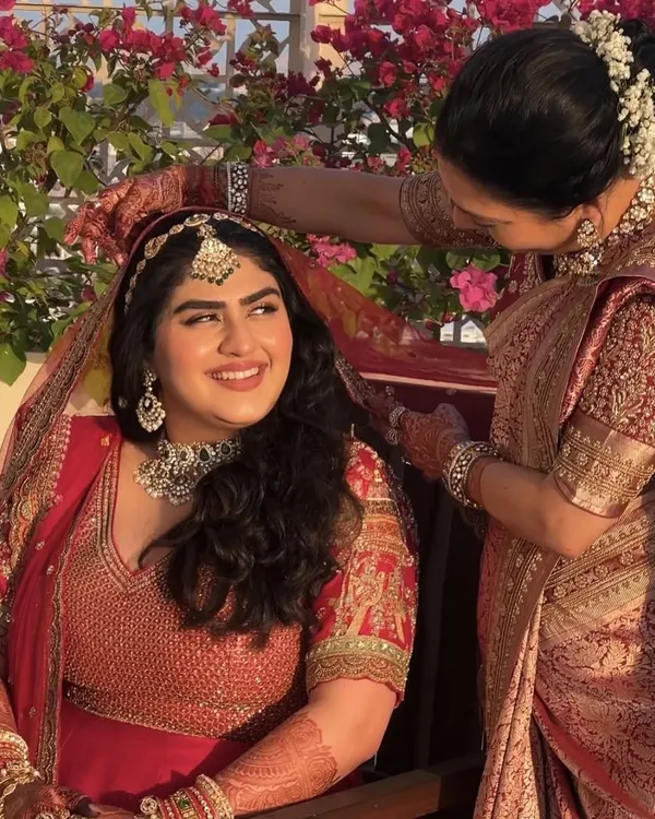 A beautiful, heartfelt moment between our bride Vaishnavi and her mother. We created a minimal and subtle look to let her natural radiance shine through in her red bridal attire.