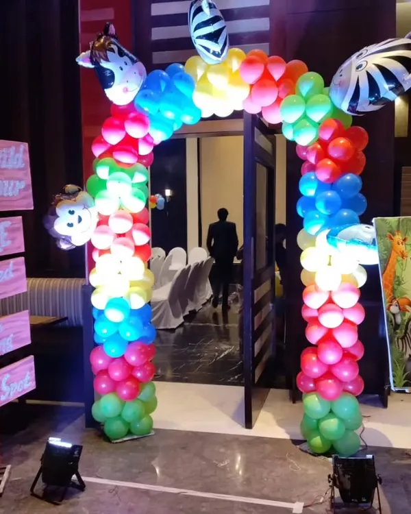 We created a fun jungle theme entrance for Ayaan's first birthday party. The setup includes a colorful balloon gate with animal accents, a custom welcome board, and themed signposts to get guests excited from the moment they arrive.