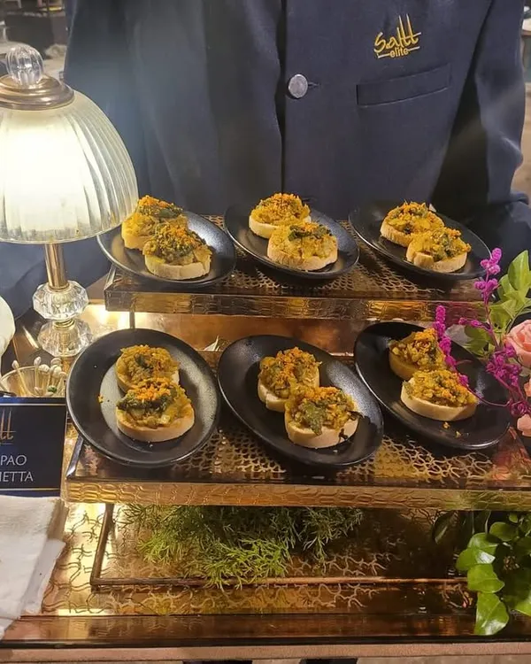 The humble Vada Pao gets a gourmet Italian makeover. Our Vada Pao Bruschetta is a crowd favourite, served on a beautiful brass tray by our staff, showcasing our innovative approach to fusion cuisine.