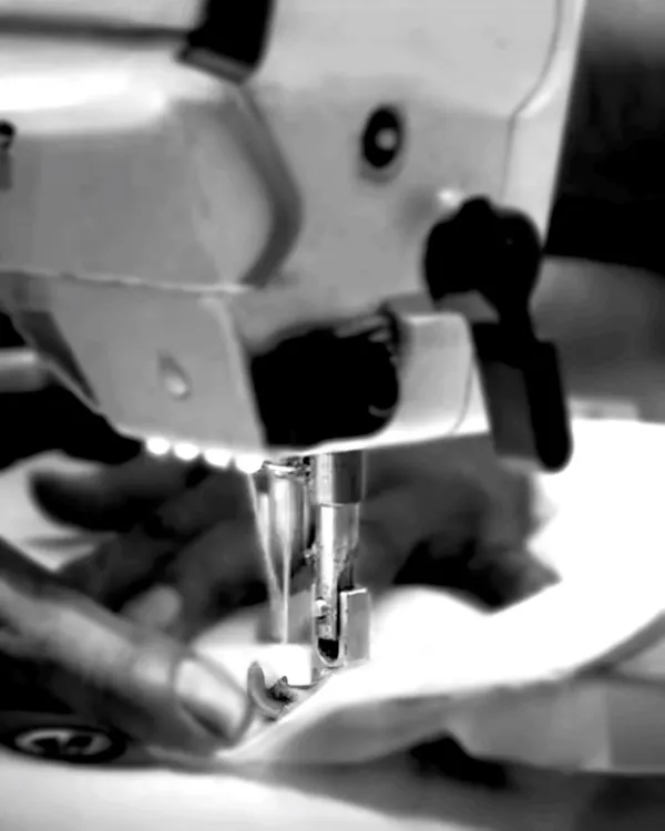 The process of creation is an art form. Here, a sewing machine brings a design to life, a moment where precision and passion are woven into every masterpiece.