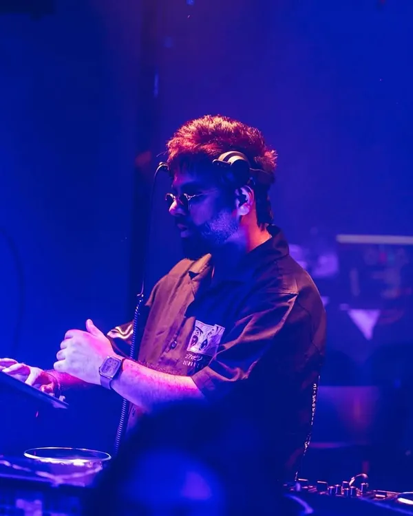 Where words fail, music speaks. A candid shot of me in my element, mixing tracks during a show.
