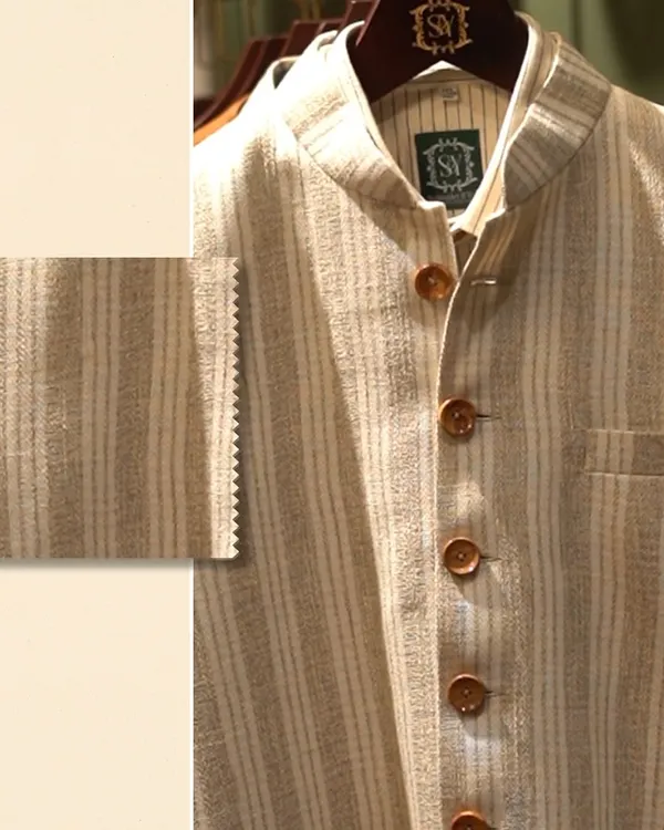 This is not just fabric; it’s your narrative. A close-up of a striped linen jacket with a swatch, showing how every texture tells a story without a single word.