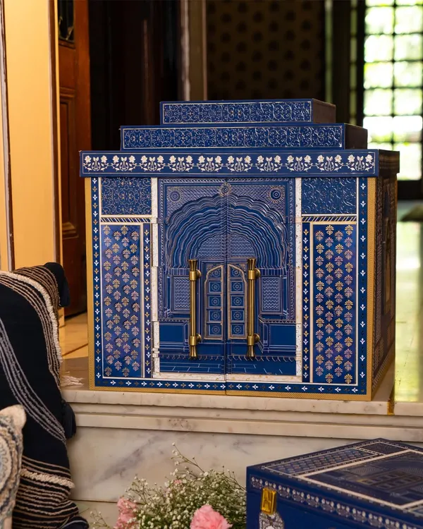 This is the heart of my Golden Dunes collection, a wedding hamper inspired by the royal grandeur of Suryagarh, Jaisalmer. The intricate blue facade and delicate craftsmanship are designed not just to hold gifts, but to become a treasured heirloom that tells a story of legacy and love.