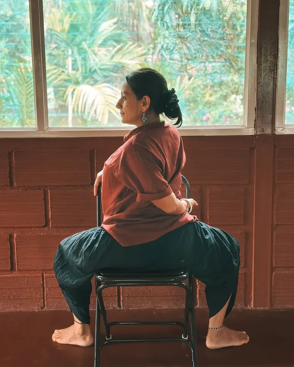 Here, Neelam demonstrates how a simple chair can be used for a deep spinal twist. This is part of our yoga therapy training, where we learn to make yoga accessible for everyone, regardless of flexibility or physical limitations.