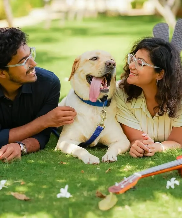 This is what pure, unfiltered joy looks like. For this lifestyle portrait session in a Bengaluru park, we just let the day unfold naturally. The result was this beautiful, candid moment of connection between a couple and their very happy Labrador.