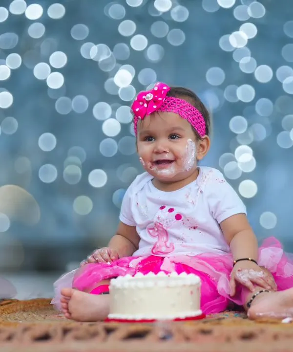A joyful first birthday cake smash! I love capturing these messy, happy moments against a beautiful, softly blurred background that makes your little one the star of the show.