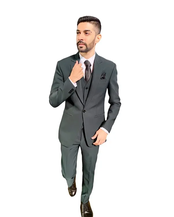 A full-length shot of me in a classic three-piece suit. For formal corporate events and elegant weddings, I ensure my attire is sharp, professional, and appropriate for the occasion.