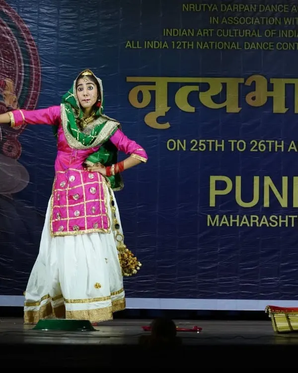 A series of photos from a Gidha performance at a national competition in Pune, showcasing the colorful costumes and lively spirit of this Punjabi folk dance.