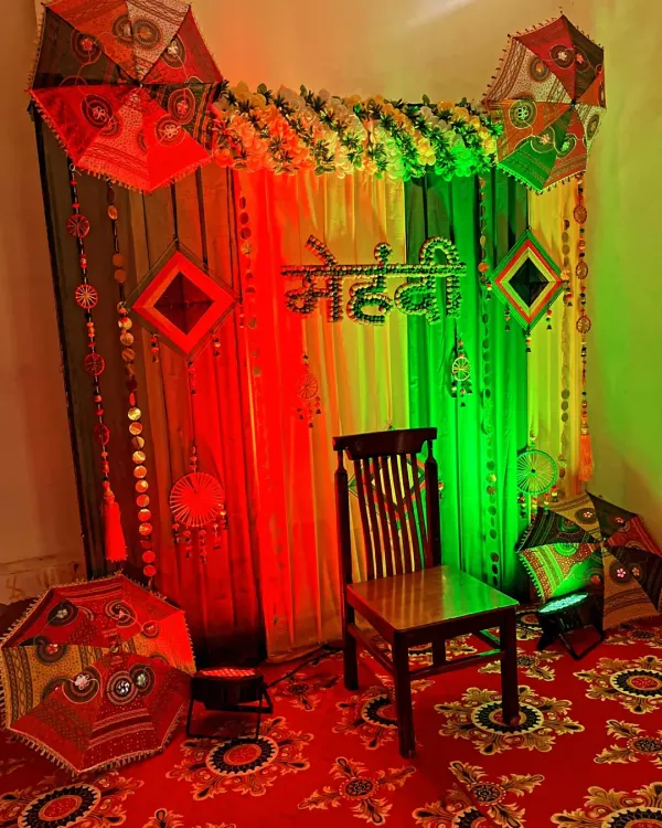 The Mehndi backdrop shown with dramatic red and green lighting, which can be changed to match the event's mood.