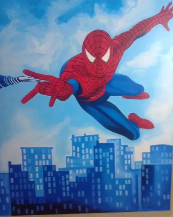 A dynamic Spider-Man mural hand-painted for a child's room, showing the superhero swinging over a city skyline to create an action-packed feature wall.