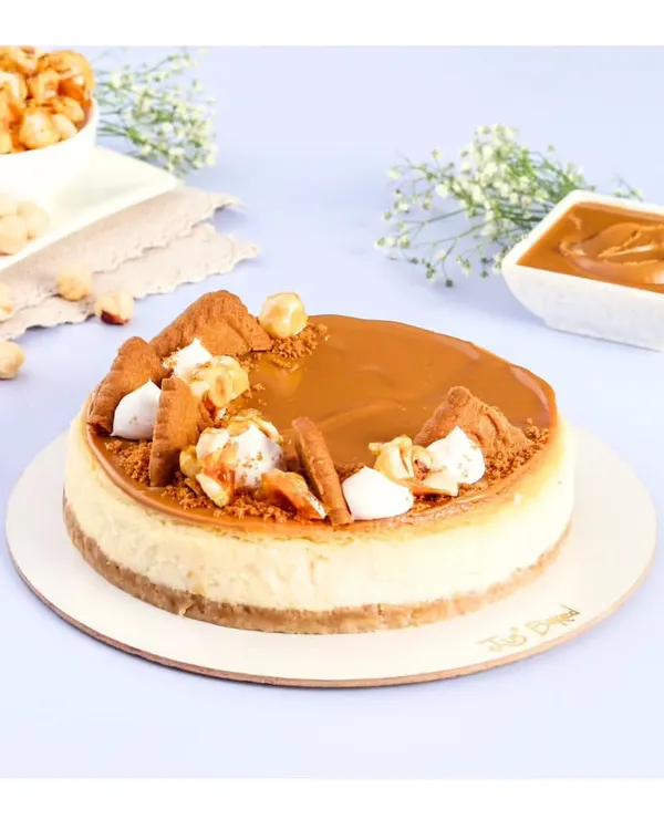 This is my pride and joy, the eggless Biscoff Baked Cheesecake. It has a perfectly crumbly crust and a rich, creamy cheesecake base, all topped with a generous layer of Biscoff spread and crunchy biscuit pieces.