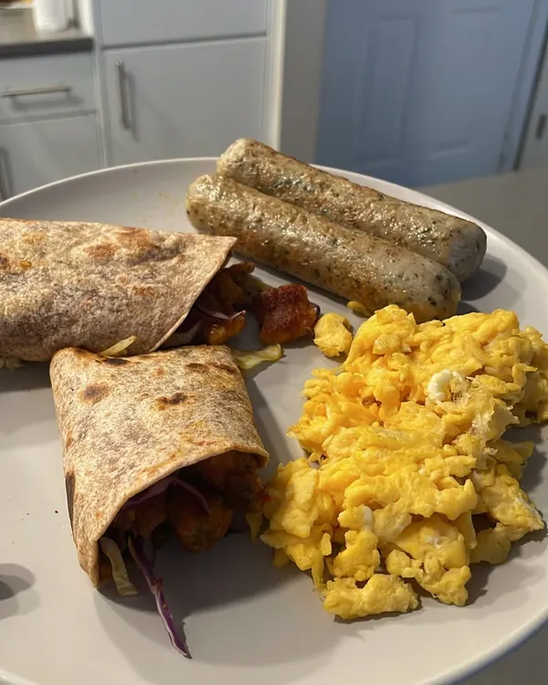A look at one of my go-to power breakfasts. Scrambled eggs, chicken sausages, and a hearty wrap give me the protein and energy I need to start my day. Eating well doesn't have to be complicated or boring.