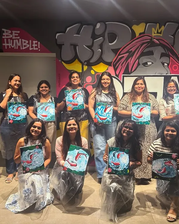 This is what pure creative energy looks like! I love seeing teams and friends come together, unwind, and create something beautiful like these koi fish paintings at a fun knife palette workshop.