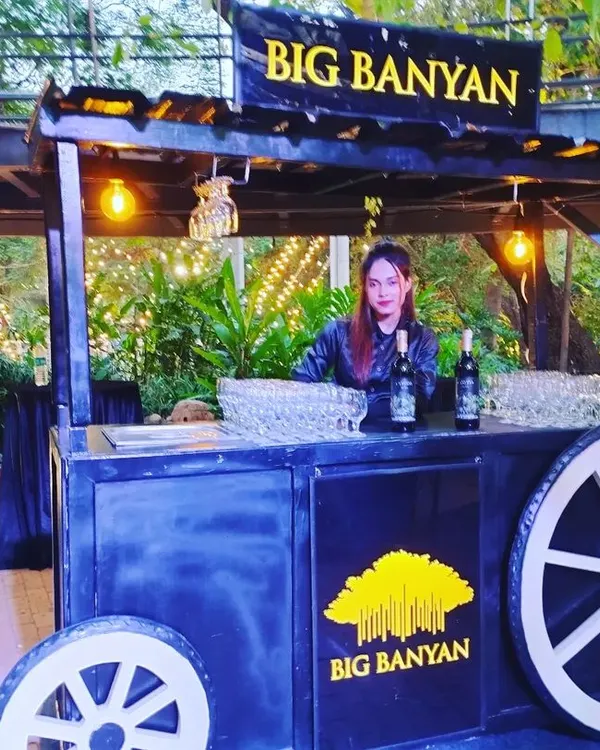 An example of our themed mobile bar carts. This rustic 'Big Banyan' wine cart is perfect for outdoor events, garden parties, and weddings, adding a touch of charm and character.