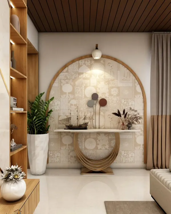A beautifully designed foyer area featuring a statement console table with a unique circular base. The arched niche with patterned wallpaper and a single pendant light creates an elegant and welcoming first impression.