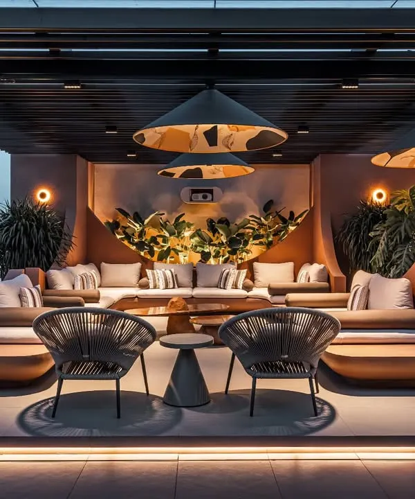 We transformed this penthouse terrace into a multi-zoned sanctuary for relaxation and entertainment. This evening view captures the ambient lighting and sculpted seating, creating an urban oasis under the stars, perfect for social gatherings or quiet reflection.