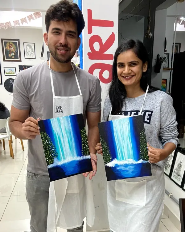 This couple created a beautiful diptych painting of a waterfall. Our couple canvas painting sessions are a great way to collaborate on a single piece of art.