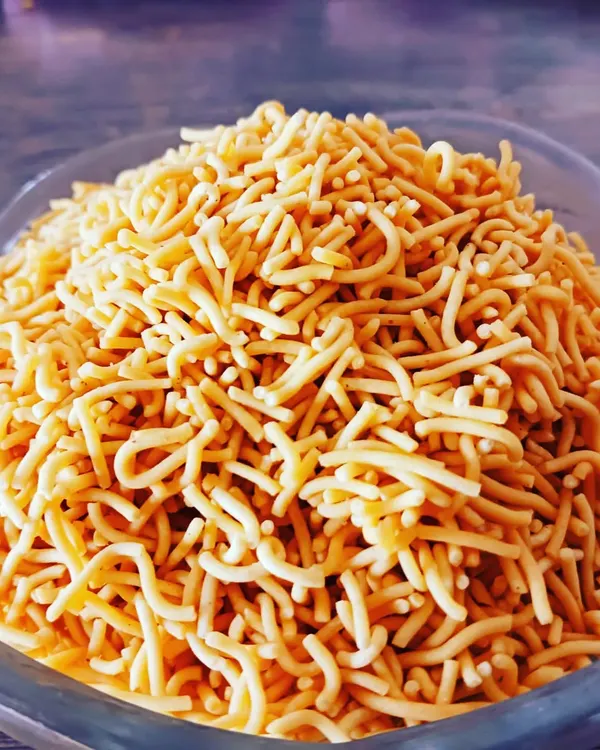 This is my roasted sev, a classic savoury noodle snack made healthy. It's crunchy and flavourful without being fried, making it a perfect guilt-free munchy.