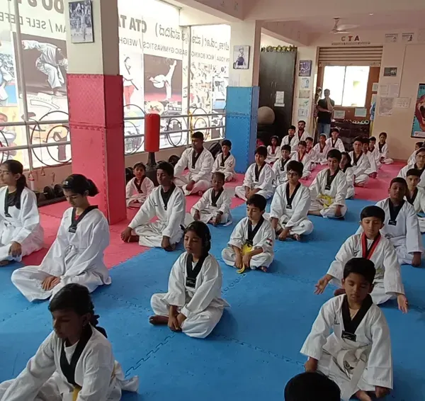 The class begins with meditation. This practice helps students clear their minds, improve focus, and prepare for the physical training ahead.