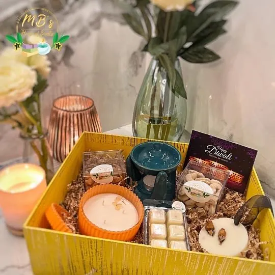 Here is my big yellow 'Box of Scents' for Diwali, filled with a three-wick candle, aroma tablet, wax melts, a diffuser, and salted nuts. It’s a complete sensory experience designed to make the festival of lights even brighter.