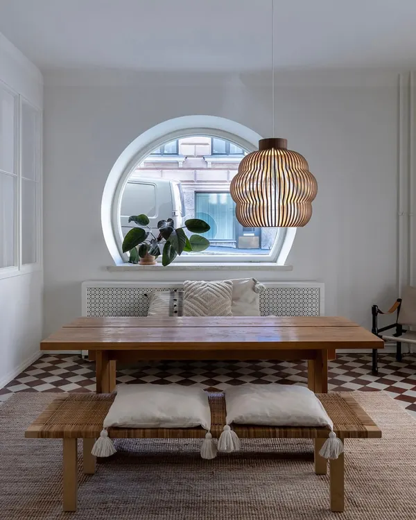 This slatted birch wood pendant, designed by architect Seppo Koho, hangs beautifully in a dining nook. Its form is inspired by summery cumulus clouds and casts a warm, inviting light.
