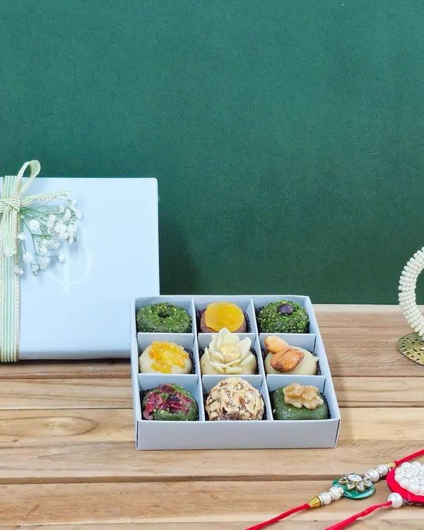 A perfect Rakhi gift, this box contains my signature nine-piece assortment of exotic dry fruit mithai. Paired with a beautiful rakhi and traditional elements, it’s a complete, heartfelt gesture.