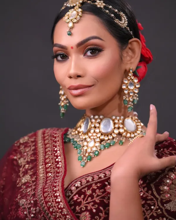 This is the quality of work I train my students to produce. Notice the flawless skin finish, the perfectly blended smokey eye, and the intricate hair detailing, all essential skills for a professional bridal artist.