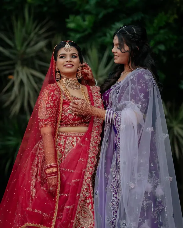 A sweet moment between the bride and her sister. We love capturing the special bonds and quiet interactions that happen amidst the wedding buzz.