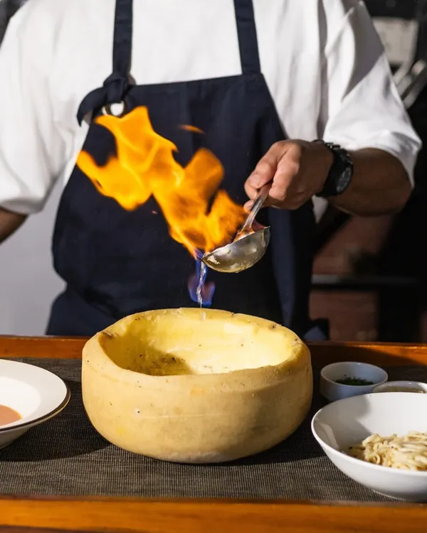 Savour the magic of fire and flavour. I bring the theatre right to your table, flambéing our Vodka Pasta live in a wheel of Parmesan for the ultimate creamy indulgence. It’s a dish that gathers a crowd and creates a memory.