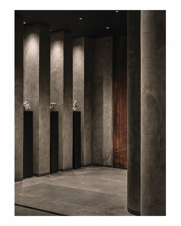 This is a glimpse into our 'Frozen' retail project, a space designed with a minimalist Zen philosophy. We used natural materials, patterns of light, and a near-monastic rejection of clutter to elevate simplicity into an art form. The concrete-finished columns create a powerful, rhythmic corridor.