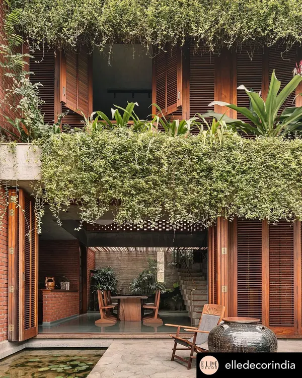 This view from the 'House of Memories' in Valsad captures my core belief in blurring the lines between indoors and outdoors. The cascading greenery creates a living curtain, making the garden an integral part of the home's architecture and daily life.
