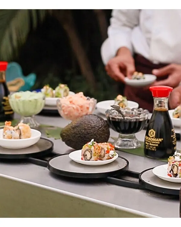 Our live sushi station features a conveyor belt, offering guests an interactive and authentic experience. We serve a variety of rolls, from classic California to vegetarian options, all made with the freshest ingredients.