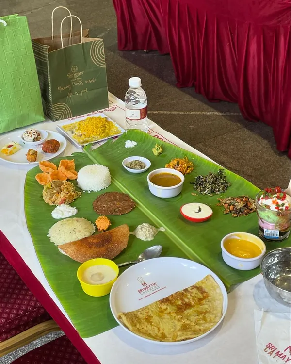 A beautifully arranged banana leaf meal prepared for a naming ceremony. Each component, from the kosambari to the payasam, is placed with care, ready to be enjoyed.