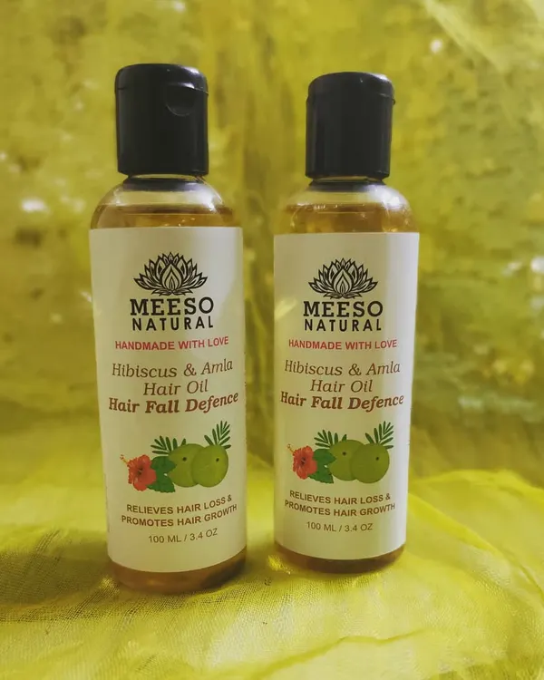 A close-up of our Hair Fall Defence Hair Oil, formulated with hibiscus and amla. This Ayurvedic hair oil blend is designed to relieve hair loss and actively promote the growth of new, stronger hair.