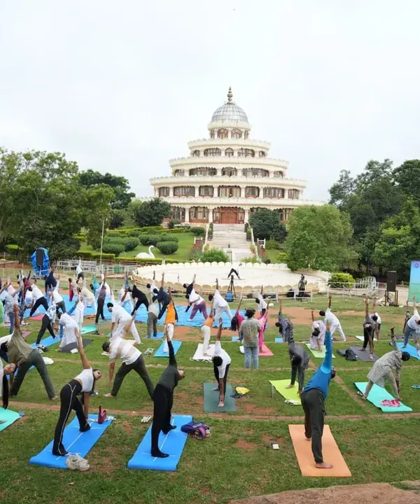 Experience the collective energy of practicing yoga together at our international center in Bengaluru. This image from an International Day of Yoga celebration shows hundreds of people finding harmony in body and mind against the backdrop of our iconic Vishalakshi Mantap.