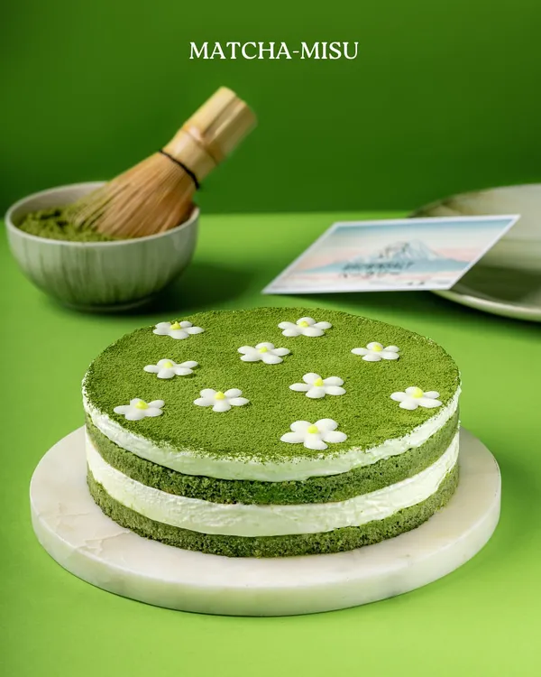 My Matchamisu, a Japanese twist on the classic tiramisu. It features layers of matcha-soaked sponge and creamy mascarpone, decorated with delicate sugar flowers.