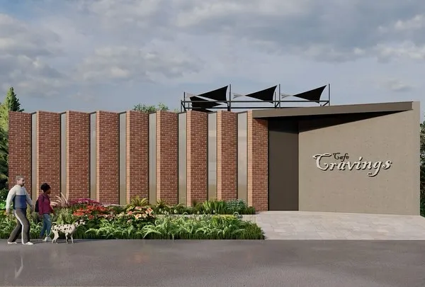 The street-front view of our 'Cafe Cravings' concept. The facade combines vertical brick panels with a sleek, modern entrance, creating an inviting and contemporary look that stands out in an urban setting.