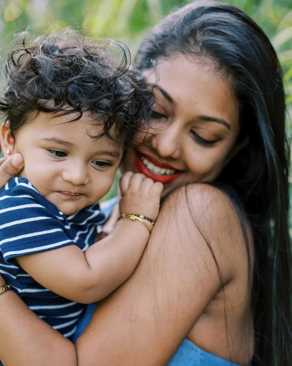 A mother and her son share a sweet, candid moment. I believe photoshoots should be fun for kids, and often the best shots happen during playful breaks.